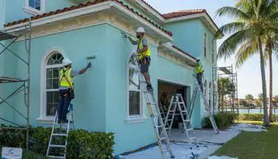 Professional painters at work in West Palm Beach, FL, providing interior and exterior painting services